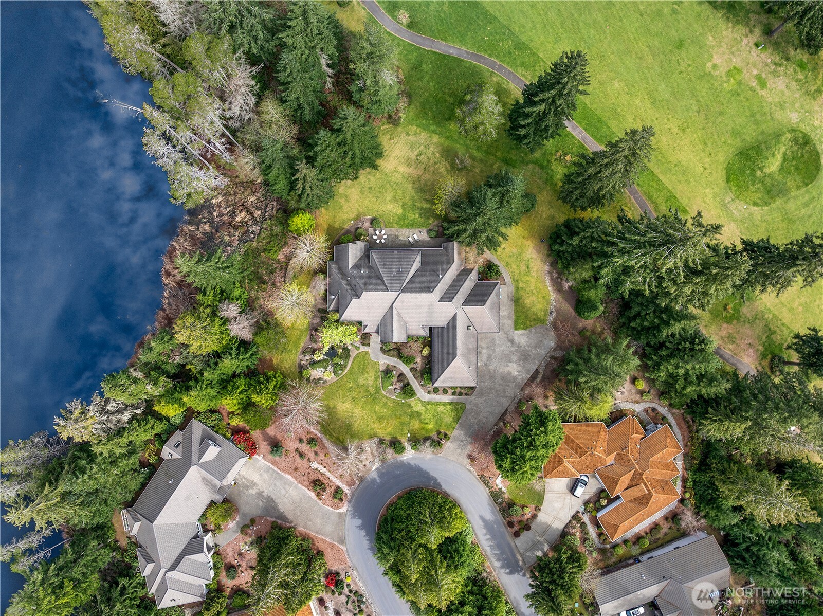 7007 Muirkirk Lane Southwest Port Orchard, WA 98367 - Photo 32 of 40 an aerial view of a house with a yard