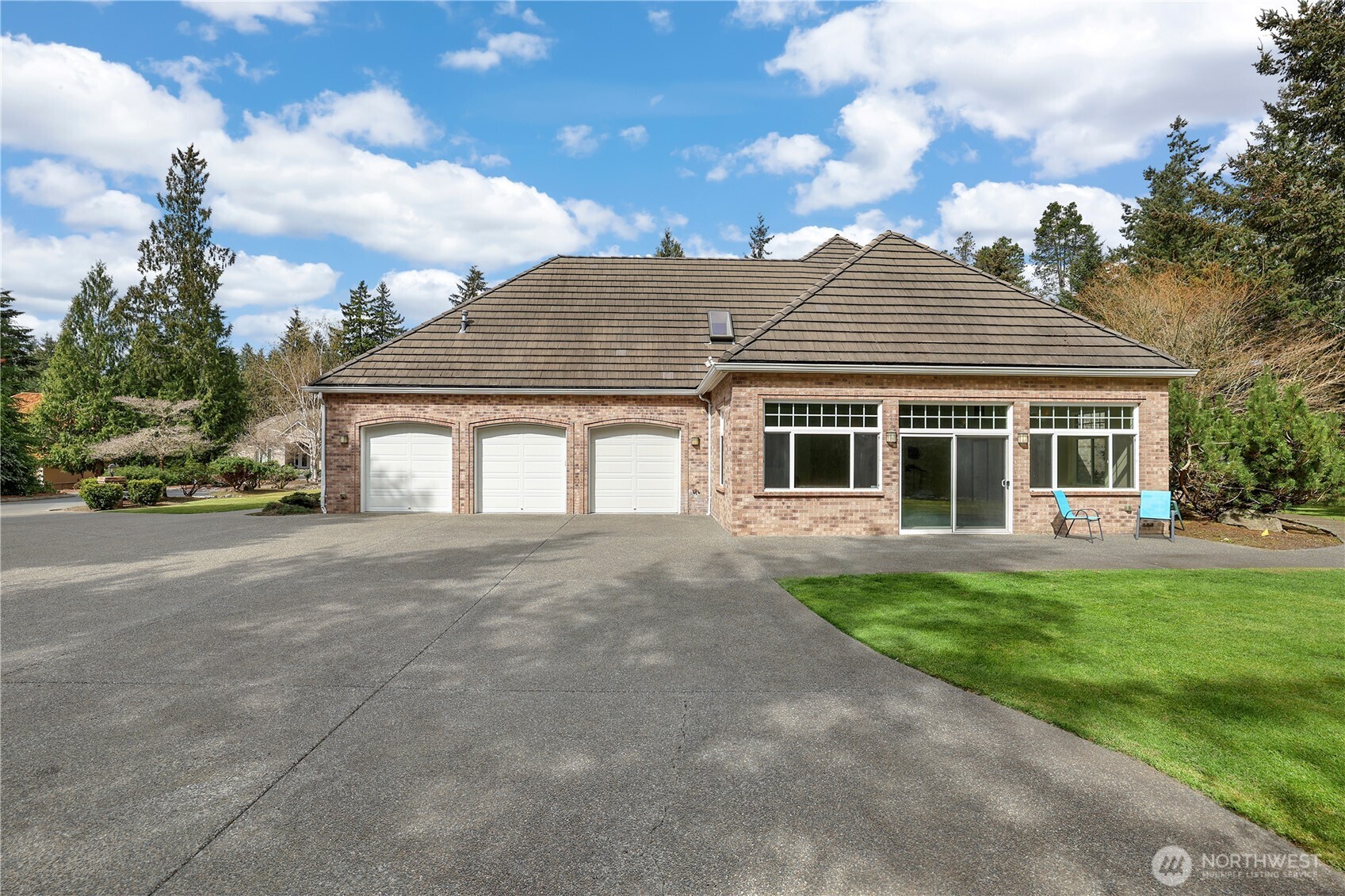7007 Muirkirk Lane Southwest Port Orchard, WA 98367 - Photo 34 of 40 a front view of a house with a garden
