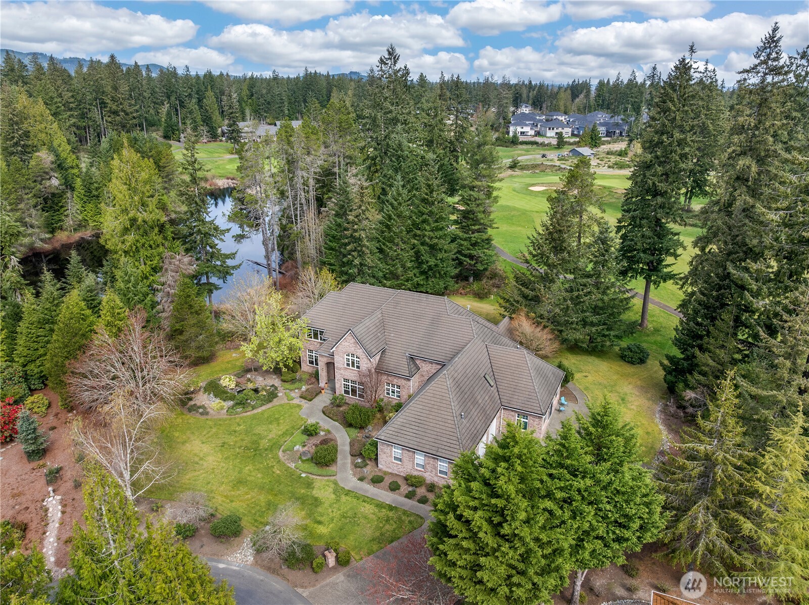 7007 Muirkirk Lane Southwest Port Orchard, WA 98367 - Photo 35 of 40 an aerial view of residential houses with outdoor space and trees