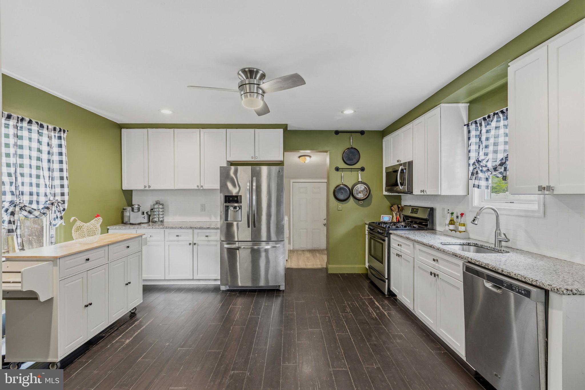 25 Maple Street Clayton, NJ 08312 - Photo 5 of 36 Modern kitchen with vibrant accents.
