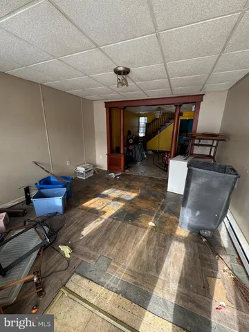 a room with wooden furniture and a table