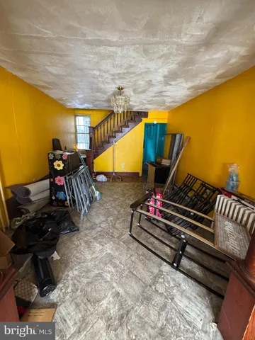 a backyard of a house with barbeque oven table and chairs