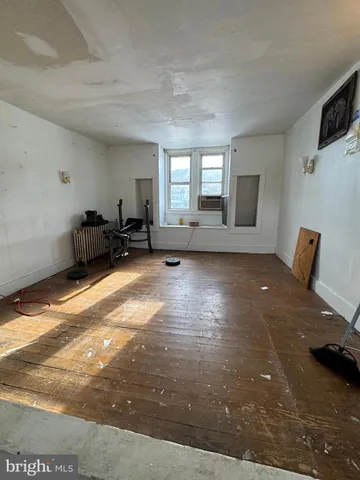 a view of a livingroom with furniture nad wooden floor