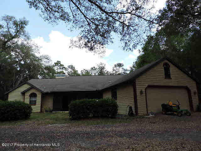 1156 Arlanie Road Brooksville, FL 34604 - Photo 1 of 27 a view of a house with a yard
