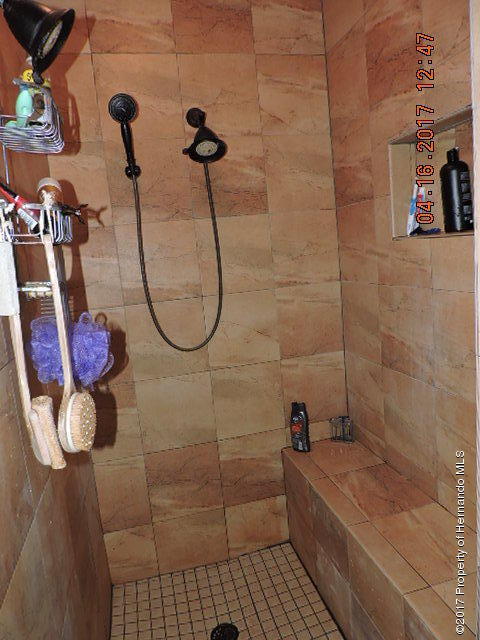 1156 Arlanie Road Brooksville, FL 34604 - Photo 19 of 27 a bathroom with a shower