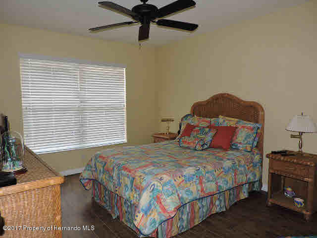 1156 Arlanie Road Brooksville, FL 34604 - Photo 20 of 27 a bedroom with a bed and window