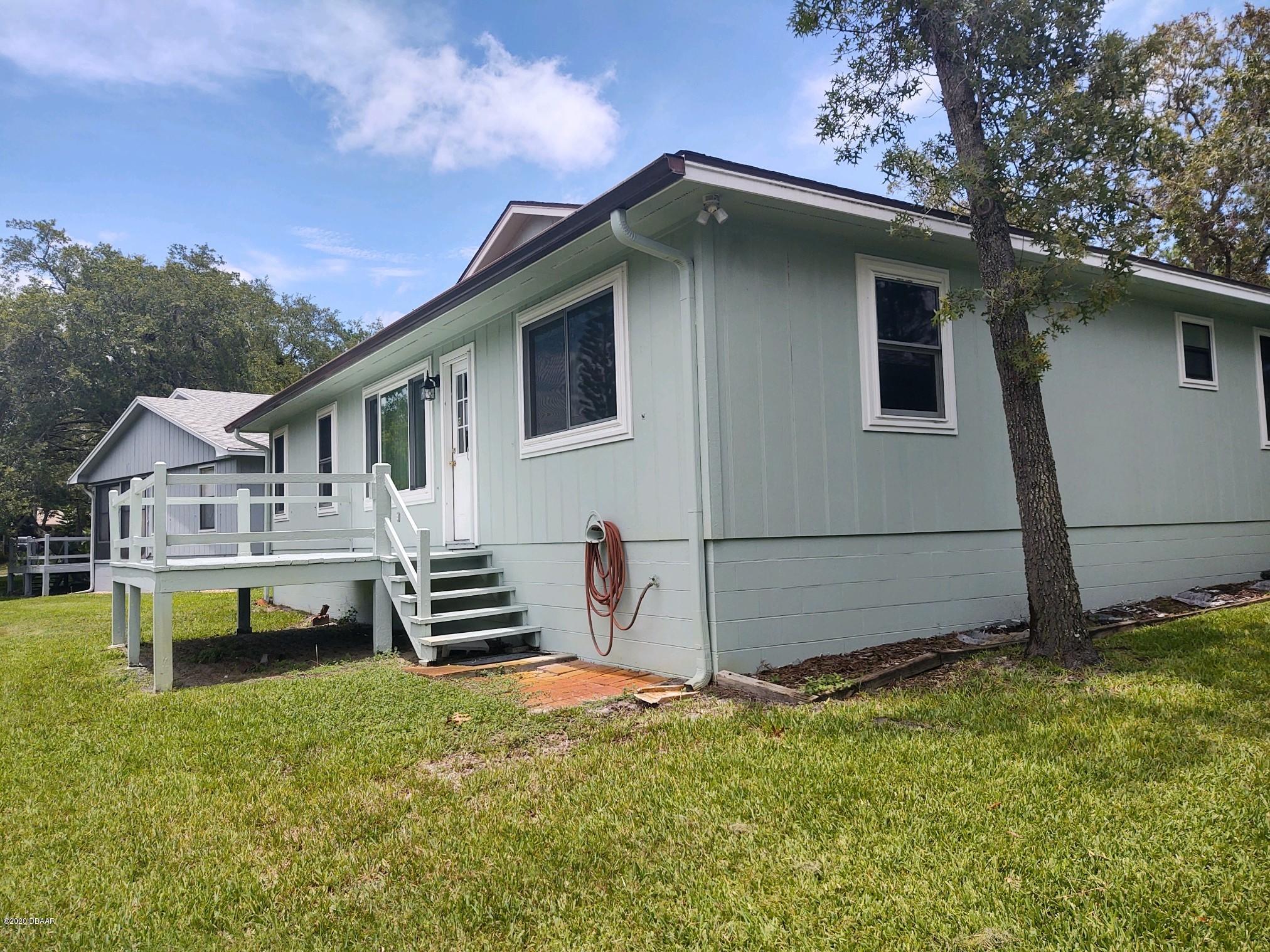 102 Rustic Pond Road Port Orange, FL 32128 - Photo 4 of 32 102Back view & deck