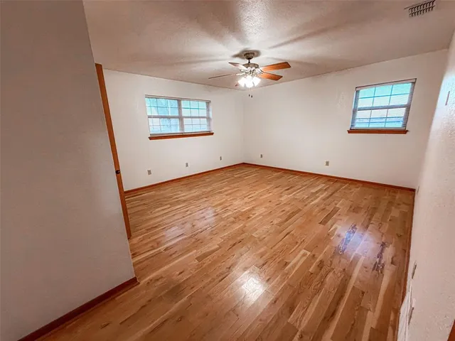 a bathroom with a granite countertop sink and shower