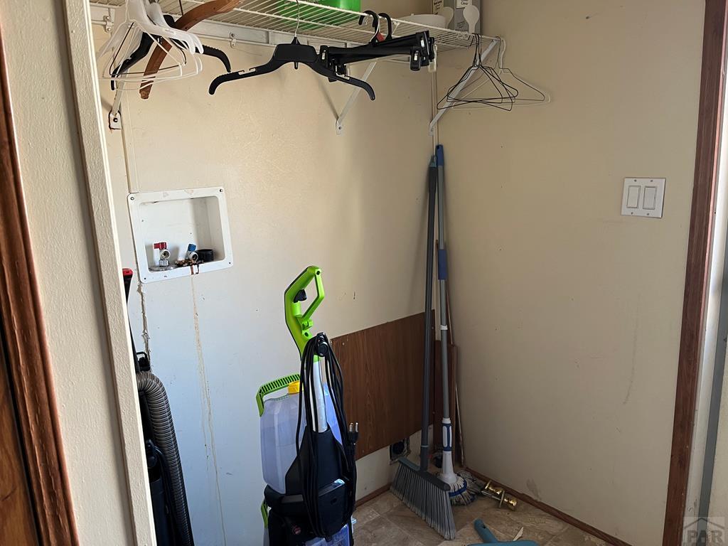 805 7th Street Fowler, CO 81039 - Photo 14 of 20 a view of a closet with storage and utility room