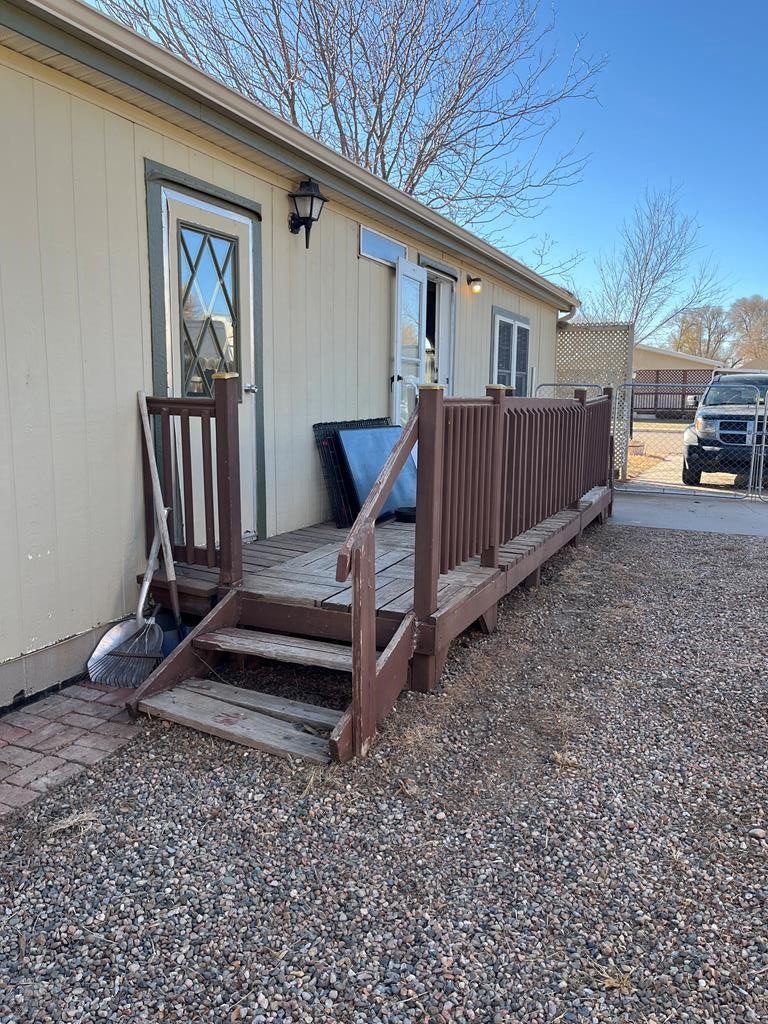 805 7th Street Fowler, CO 81039 - Photo 16 of 20 a view of front door and deck of the house