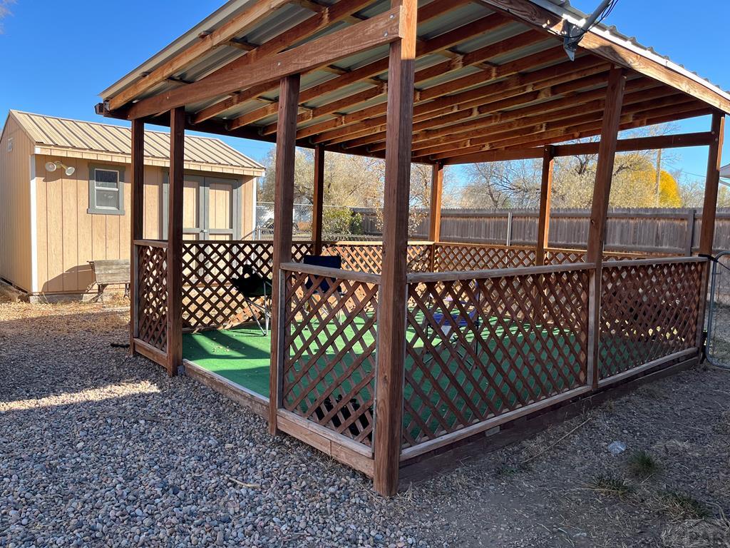 805 7th Street Fowler, CO 81039 - Photo 18 of 20 a view of a backyard with wooden fence