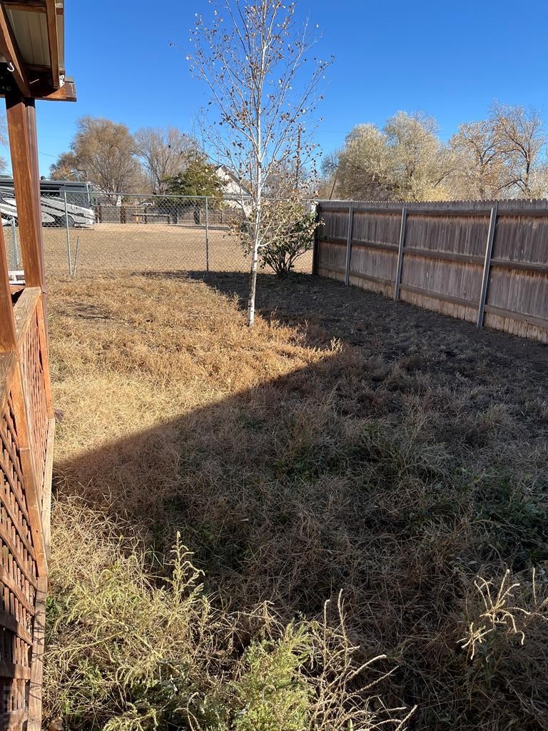 805 7th Street Fowler, CO 81039 - Photo 19 of 20 a view of a yard with wooden fence