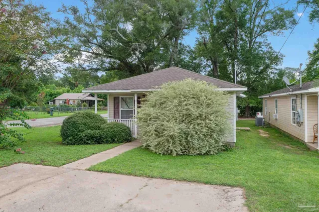a front view of a house with garden