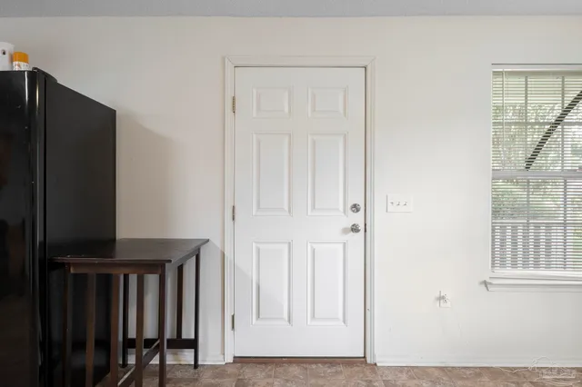 an entryway with wooden floor