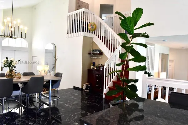 a dining room with furniture and entryway