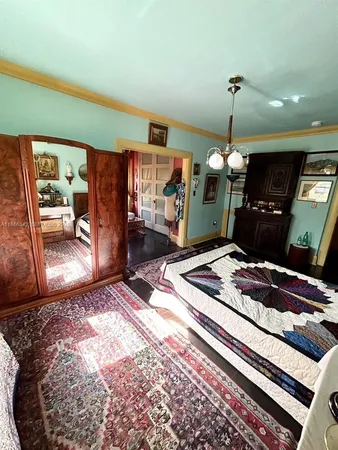 a bed room with a bed and a television