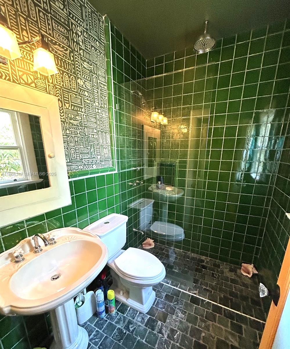168 Northeast 44th Street Miami, FL 33137 - Photo 18 of 46 a bathroom with a sink toilet and shower