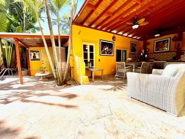 a view of a backyard with a patio