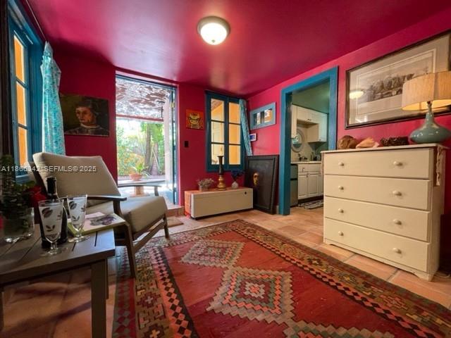 168 Northeast 44th Street Miami, FL 33137 - Photo 30 of 46 a bedroom with a bed and wooden floor