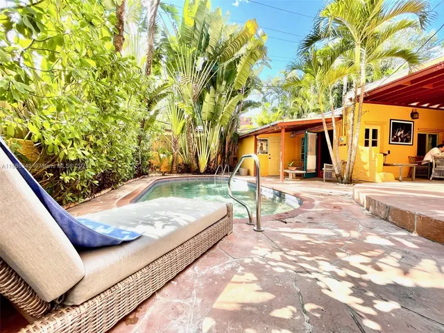 a view of a backyard with a patio