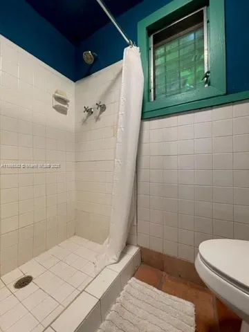 a bathroom with a toilet and a sink