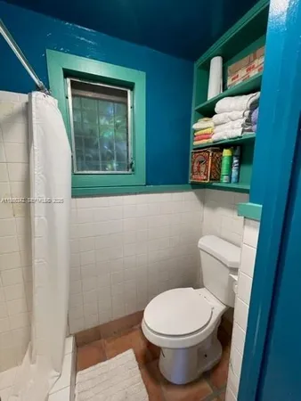 a bathroom with a toilet and a sink