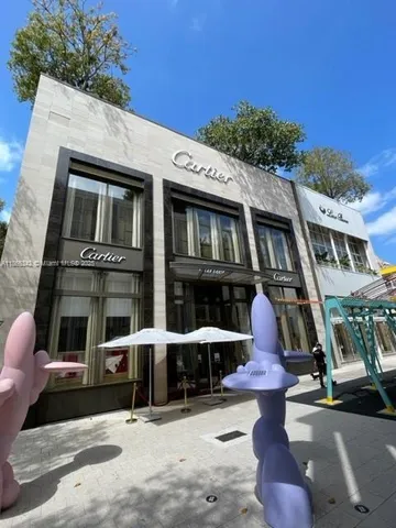 a view of a chair and tables in the patio