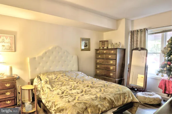 a bedroom with a bed and furniture