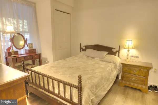 a bedroom with a bed and a table