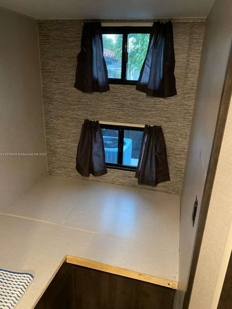 25236 Southwest 133rd Avenue Homestead, FL 33032 - Photo 11 of 17 a view of an empty room and window