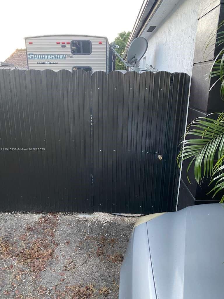25236 Southwest 133rd Avenue Homestead, FL 33032 - Photo 16 of 18 a view of a wooden fence