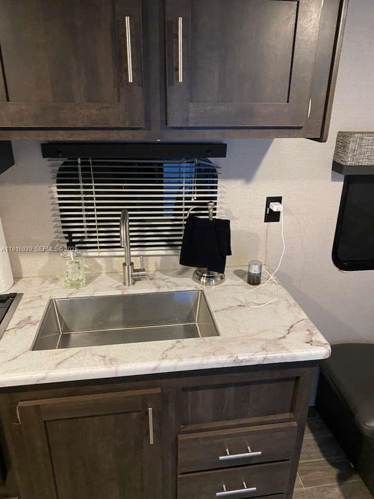 25236 Southwest 133rd Avenue Homestead, FL 33032 - Photo 3 of 18 a kitchen with a sink and wooden floor
