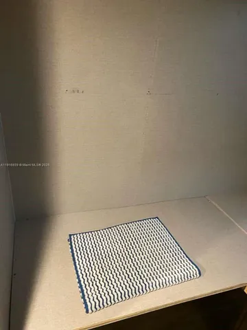 a view of an empty room and window