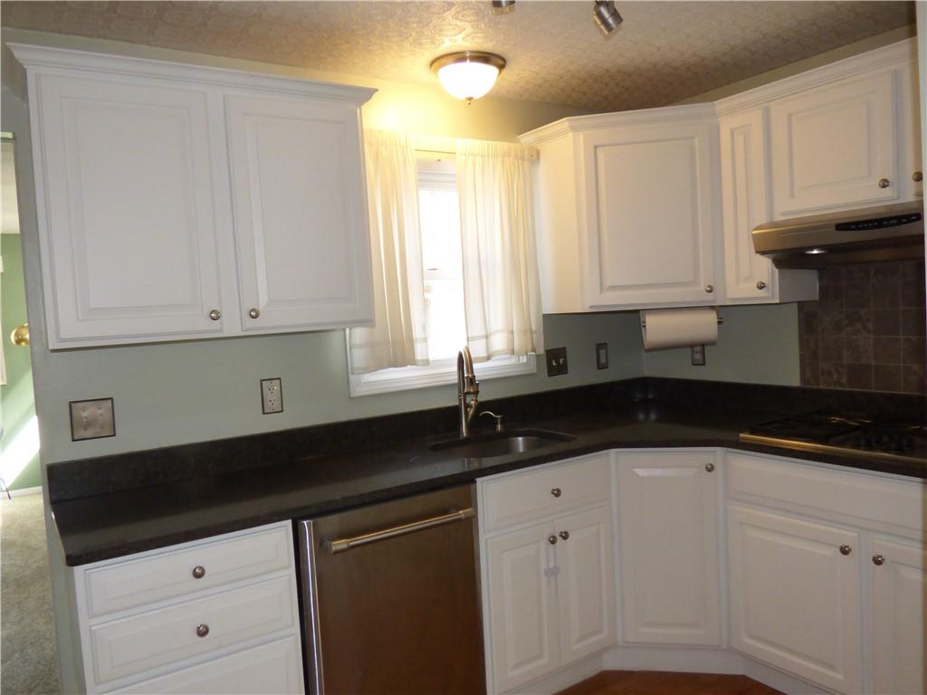 9120 Collington Square Allison Park, PA 15101 - Photo 12 of 38 a kitchen with granite countertop white cabinets and sink