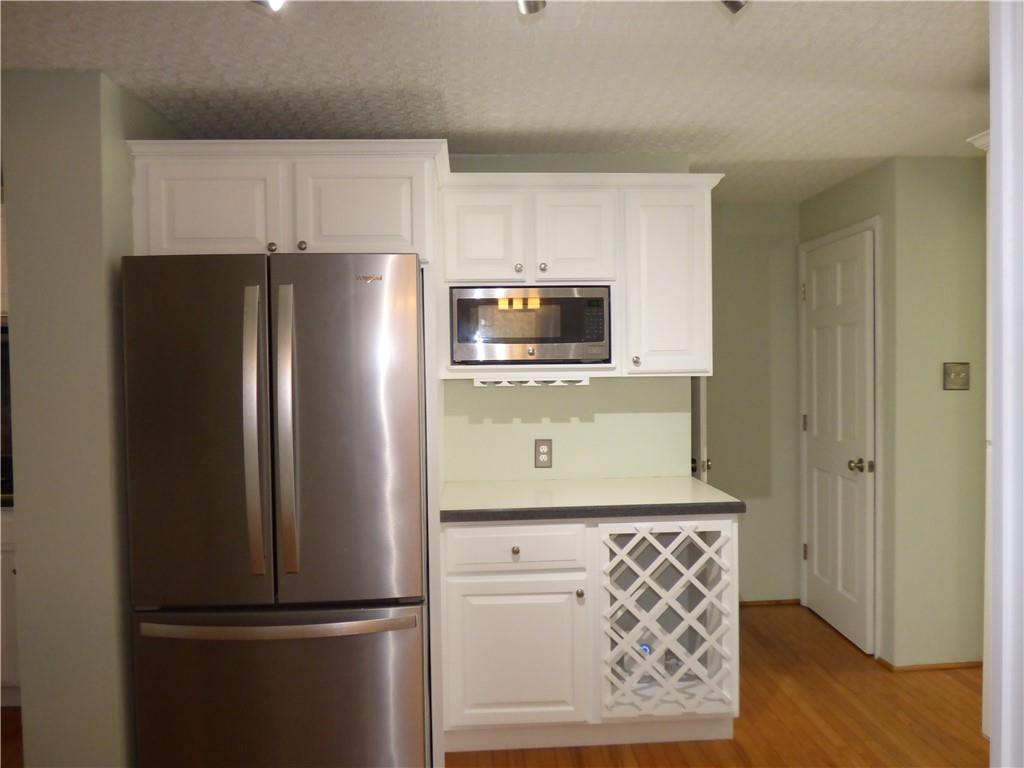 9120 Collington Square Allison Park, PA 15101 - Photo 14 of 38 a kitchen with stainless steel appliances granite countertop a refrigerator and a stove top oven