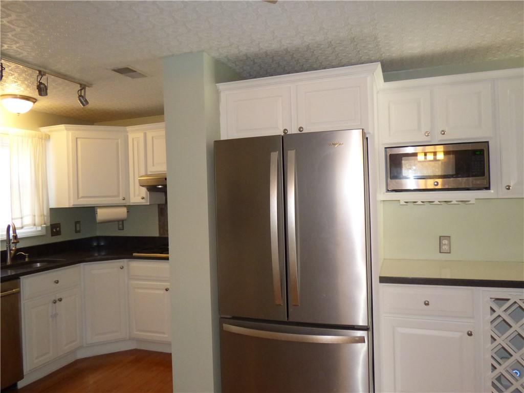 9120 Collington Square Allison Park, PA 15101 - Photo 17 of 38 a metallic refrigerator freezer sitting in a kitchen