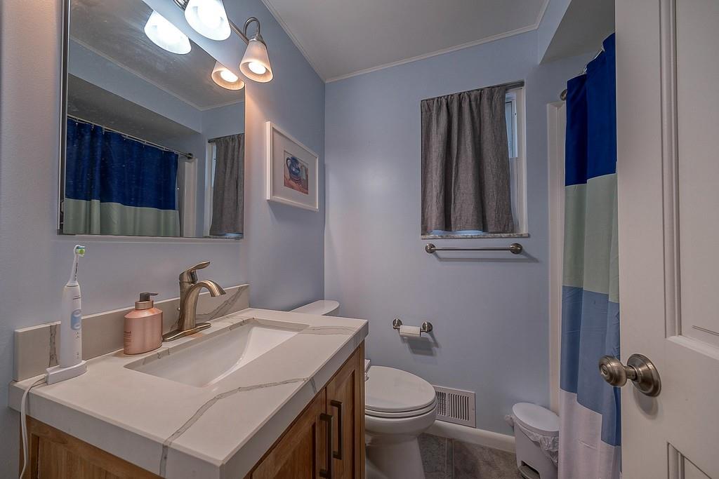 9120 Collington Square Allison Park, PA 15101 - Photo 24 of 38 a bathroom with a sink a toilet and mirror