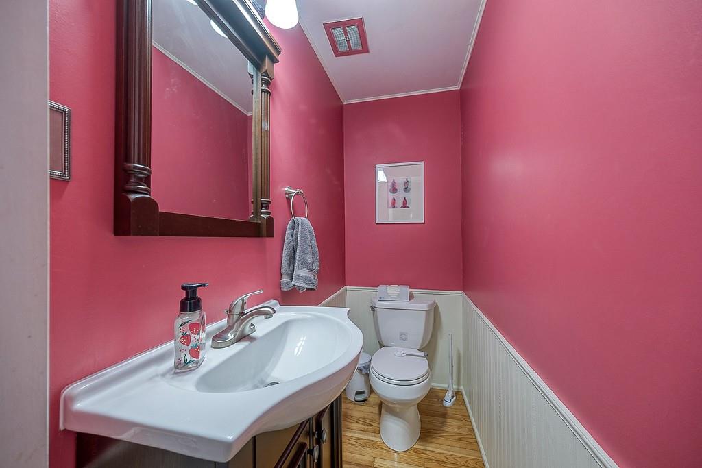 9120 Collington Square Allison Park, PA 15101 - Photo 33 of 38 a bathroom with a sink a toilet and mirror