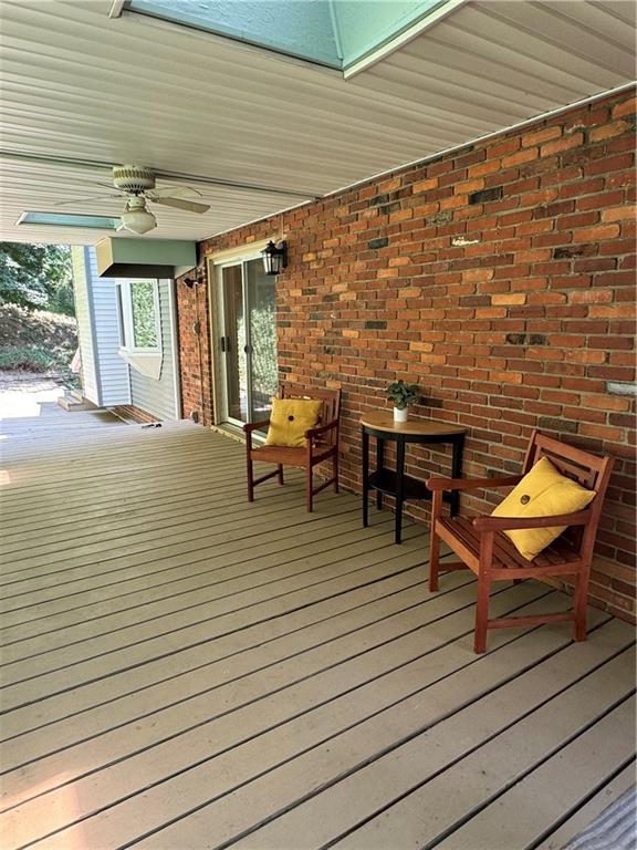 9120 Collington Square Allison Park, PA 15101 - Photo 37 of 38 a view of a patio with table and chairs with wooden floor