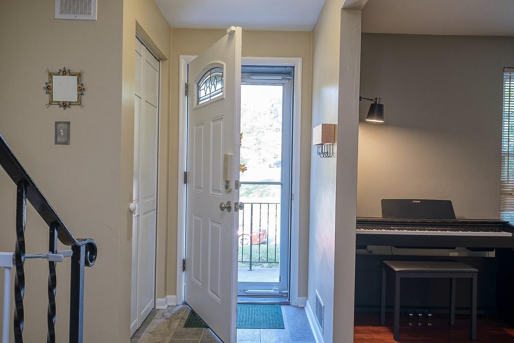 9120 Collington Square Allison Park, PA 15101 - Photo 5 of 38 a view of a hallway with entryway wooden floor and front door