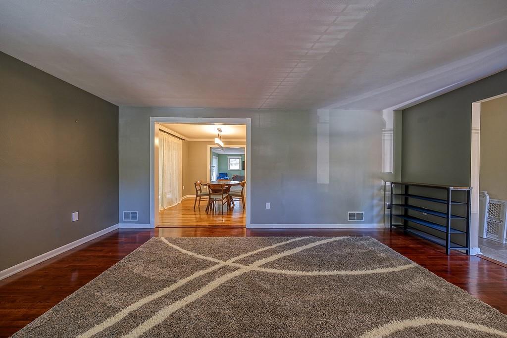 9120 Collington Square Allison Park, PA 15101 - Photo 8 of 38 a view of a livingroom with wooden floor and white walls