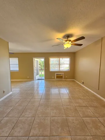 a view of an empty room with a window