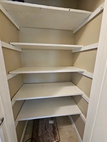 a close view of closet with wooden floor