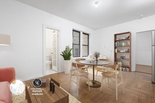 a kitchen with refrigerator and chairs