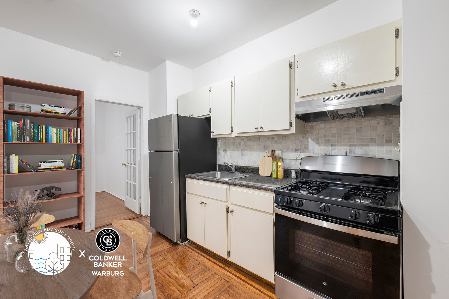 1793 Riverside Drive, Unit 2G Manhattan, NY 10034 - Photo 3 of 12 a kitchen with refrigerator and stove