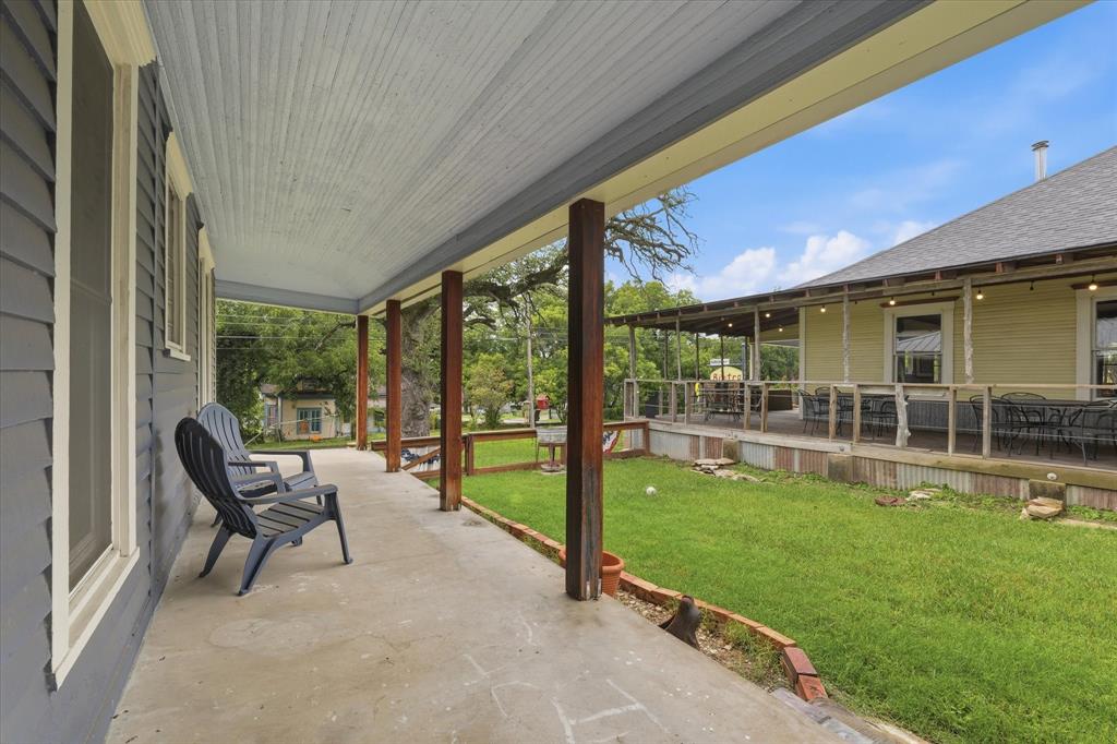 415 South Rice Street Hamilton, TX 76531 - Photo 25 of 28 Covered side porch with a beadboard ceiling