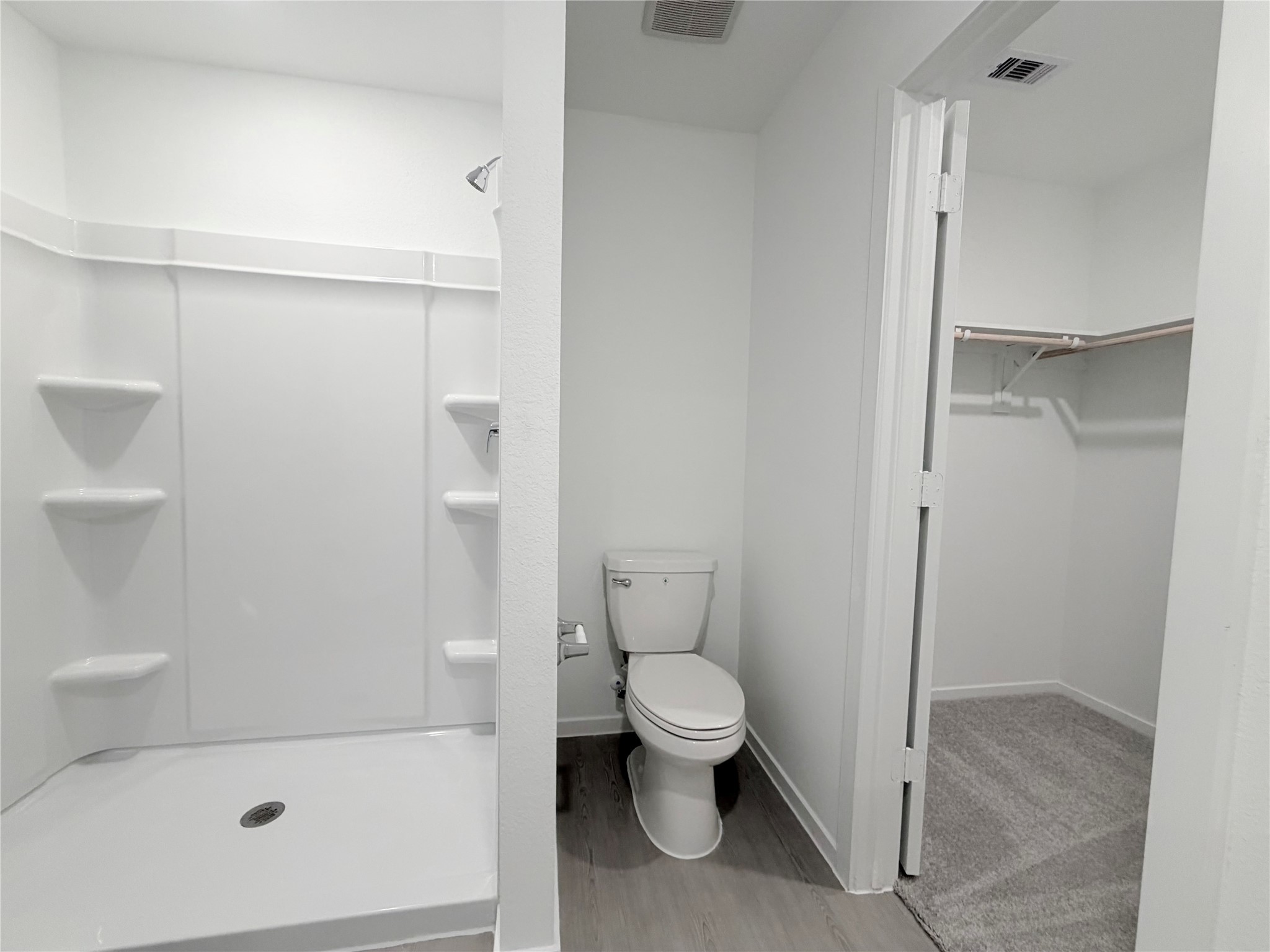 447 Southern Magnolia Way Magnolia, TX 77354 - Photo 18 of 21 a bathroom with a toilet and a shower