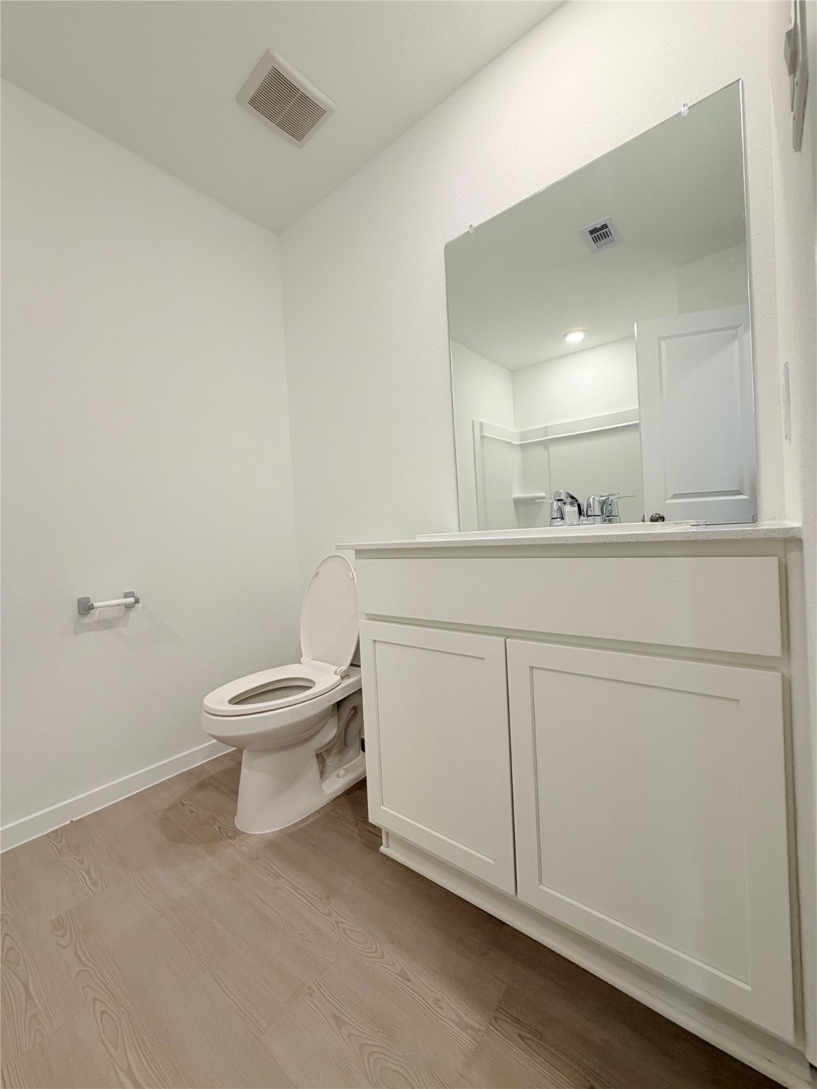 447 Southern Magnolia Way Magnolia, TX 77354 - Photo 5 of 21 a bathroom with a toilet a sink and mirror