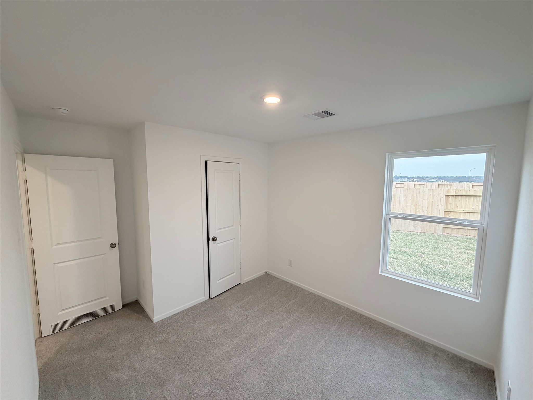447 Southern Magnolia Way Magnolia, TX 77354 - Photo 8 of 21 an empty room with windows