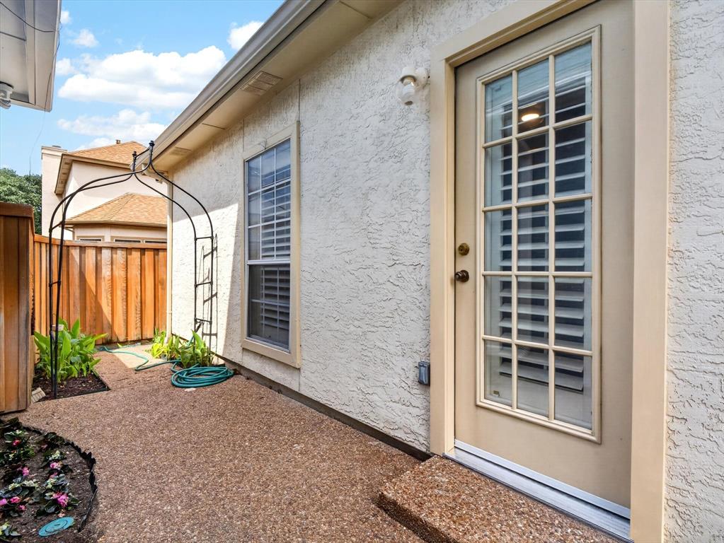 4345 Timberglen Road Dallas, TX 75287 - Photo 21 of 26 a front view of a house with a yard